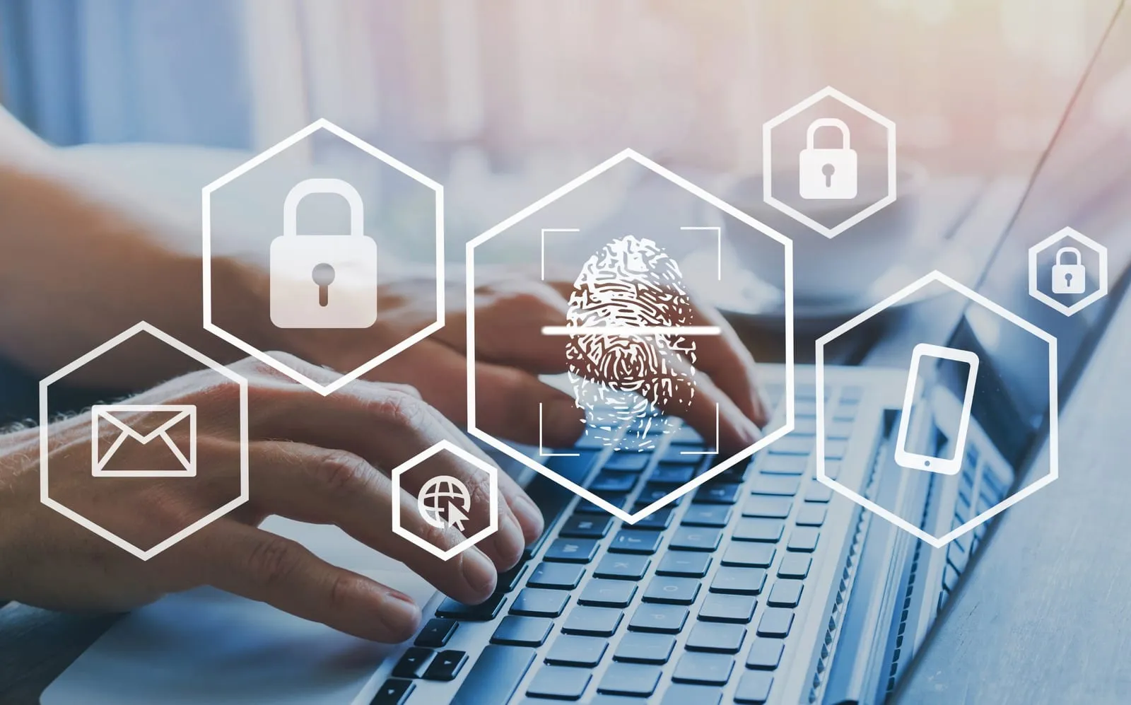 Hands typing on a laptop surrounded by padlock, fingerprint, email, and phone security icons